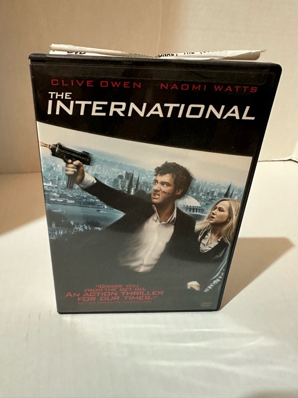 The International DVD - Back Cover (Black, White, Red, Blue)